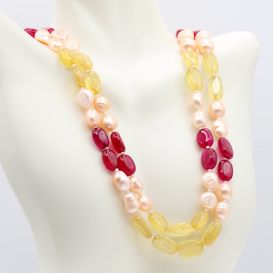Fresh Water Pearl with Bi-Color Jade multi-strand necklace showcasing elegance and versatility on a display.