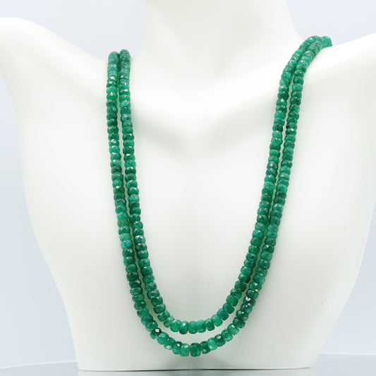 Emerald Multi Layered Necklace featuring semi-translucent green emeralds in faceted rondelle cut.
