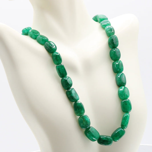 Emerald Nugget Beaded Necklace displayed elegantly on a mannequin, showcasing natural emerald stones.