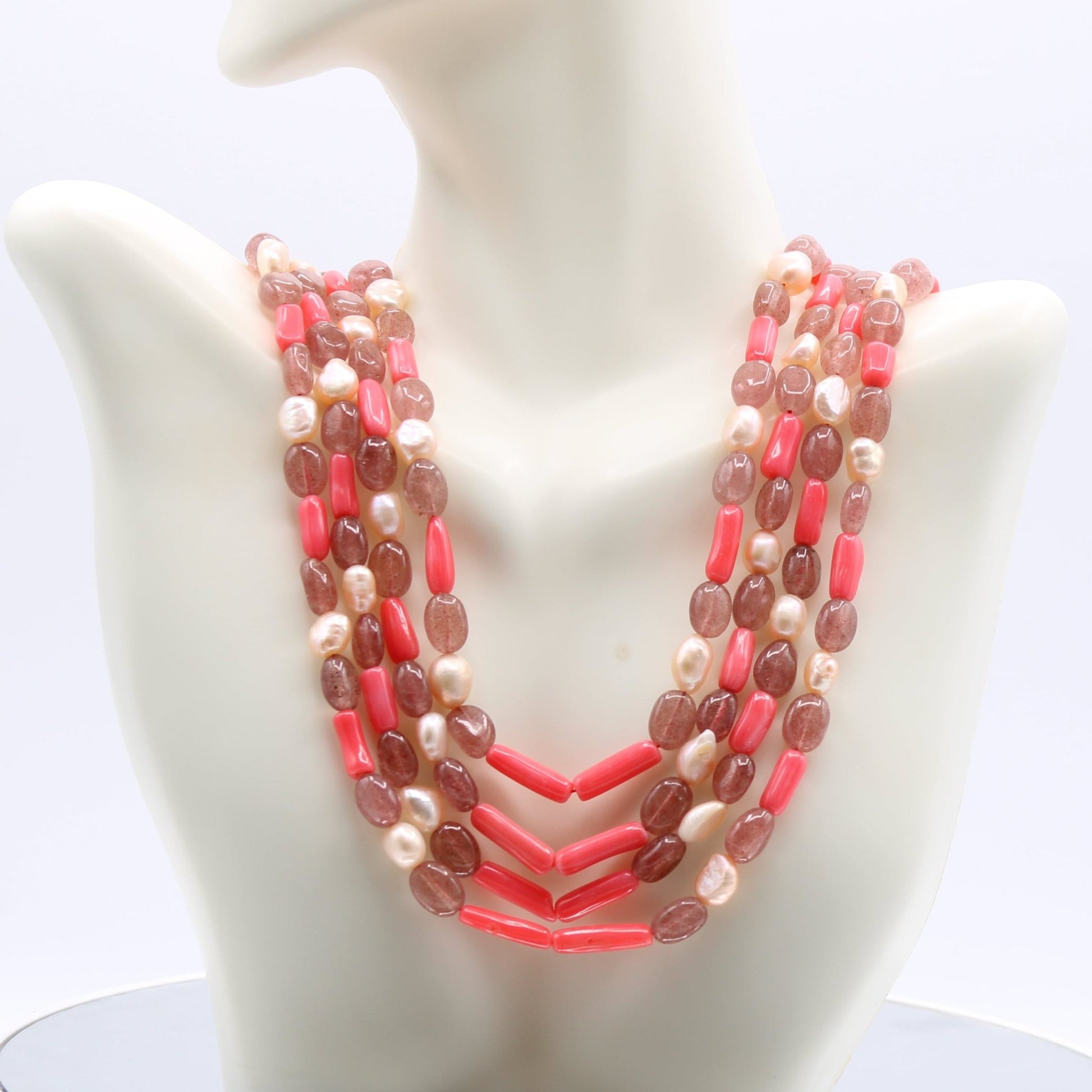 Strawberry Quartz Pearl & Coral - Layered Necklace showcasing pink gemstones on a mannequin display.
