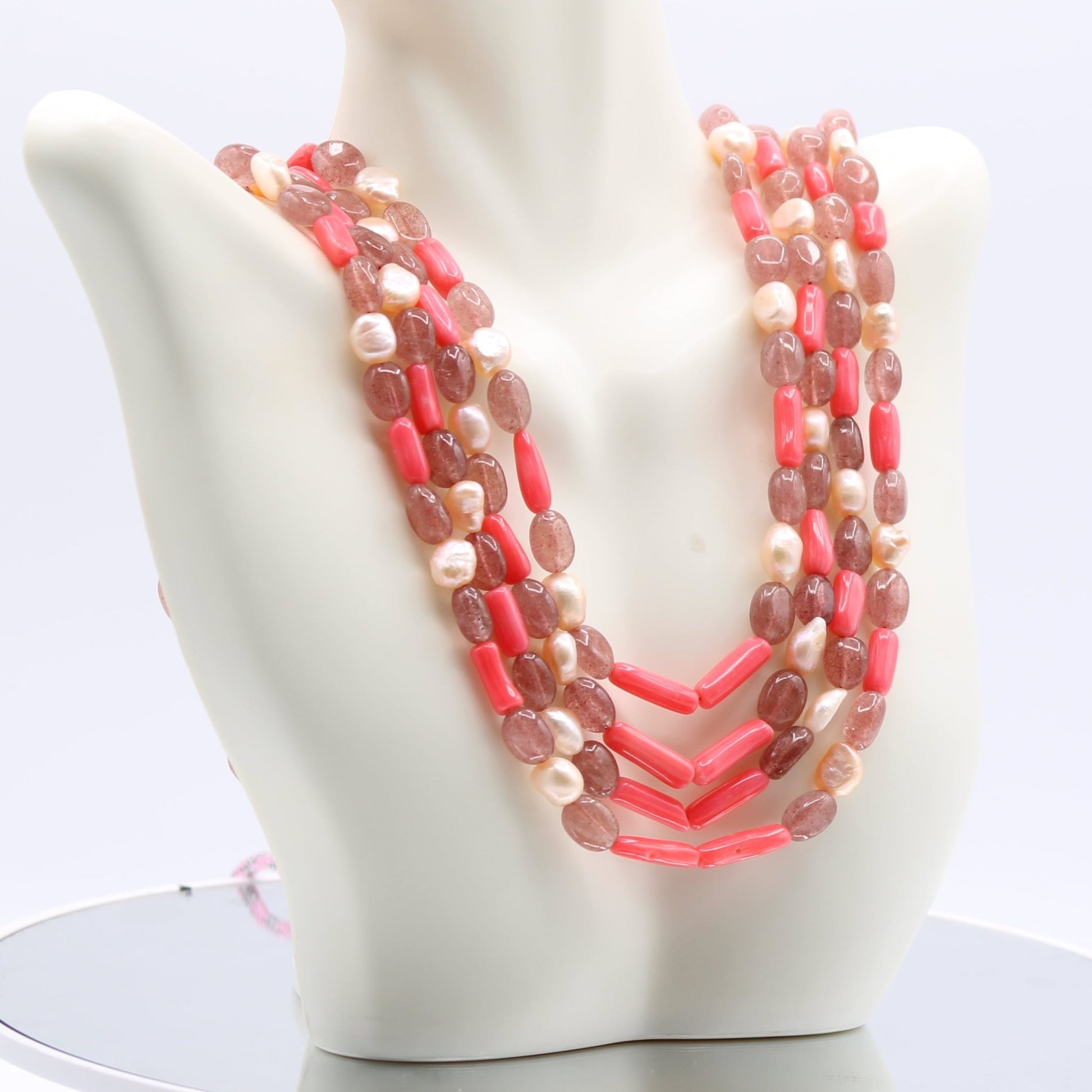 Strawberry Quartz Pearl & Coral - Layered Necklace displayed on a white bust, showcasing pink semi-transparent gemstones.