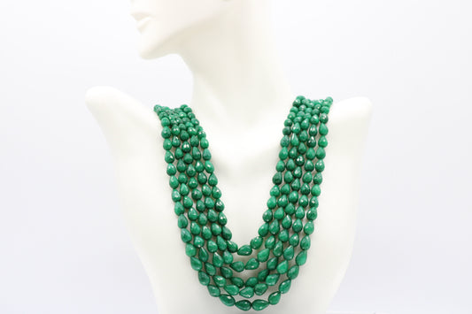 The Dark Green Sapphire Briolette Pearl Shaped Necklace displayed on a mannequin, showcasing its elegant design.