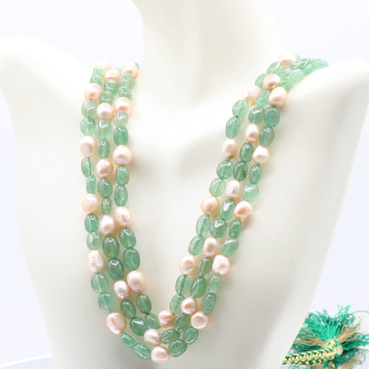 Russian Emerald with pearl layered necklace showcasing green quartz beads and pearls for energy amplification.