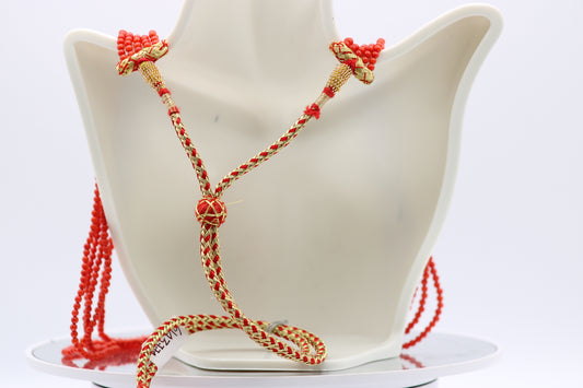Coral necklace 3mm round -5 strands displayed on a bust, featuring a reddish orange color and opaque polished cut.