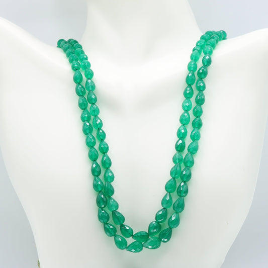 Emerald Pear Shape Faceted Necklace featuring two strands of semi-transparent green emerald beads.