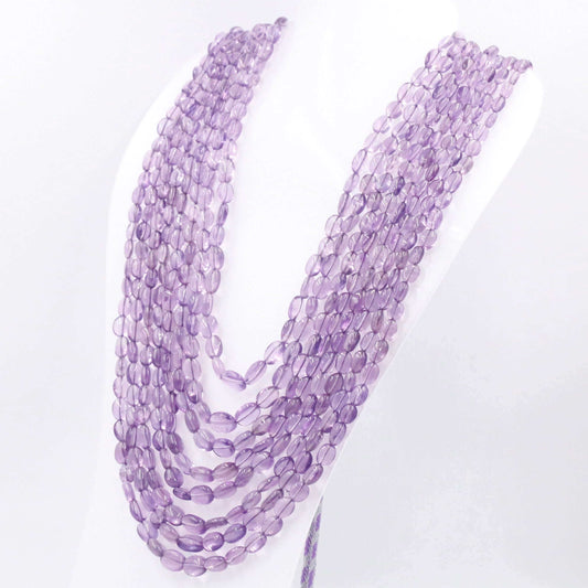Elegant amethyst necklace jewelry displayed on a mannequin, showcasing multiple strands of translucent purple beads.