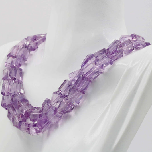 Amethyst Quartz Beaded Necklace showcasing stunning violet hues and bold geometric beads on a mannequin.
