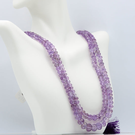 Amethyst Faceted Beaded Necklace displayed on a mannequin, showcasing its purple hues and elegant design.