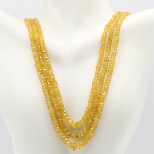 Yellow Sapphire faceted necklace showcasing elegant yellow gemstones on display