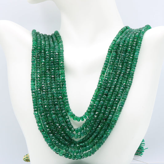 Emerald multi layered necklace featuring semi-translucent faceted rondelle emerald stones in vibrant green color.