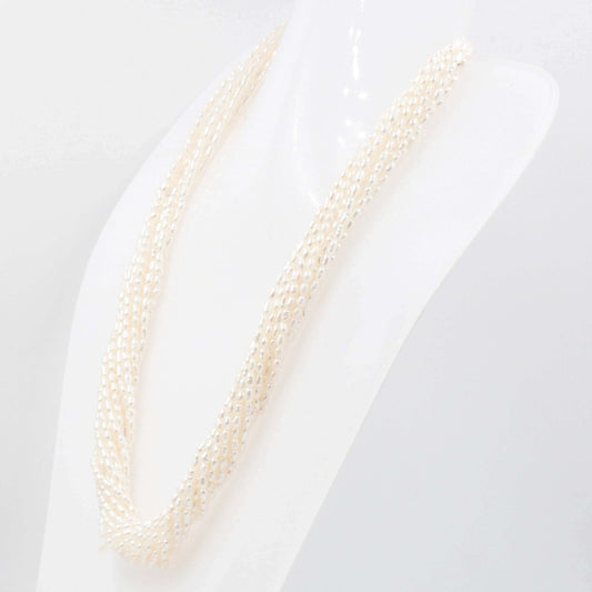 Freshwater rice pearl strand necklace displayed on a mannequin, showcasing its elegant and lustrous design.