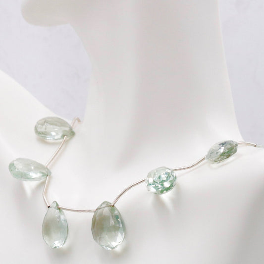 Natural Prasiolite Briolette Strand showcasing light green quartz gemstones on a delicate chain.
