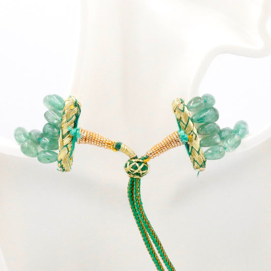 Russian Emerald and Pearl necklace featuring intricate woven details and beautiful green gemstones.