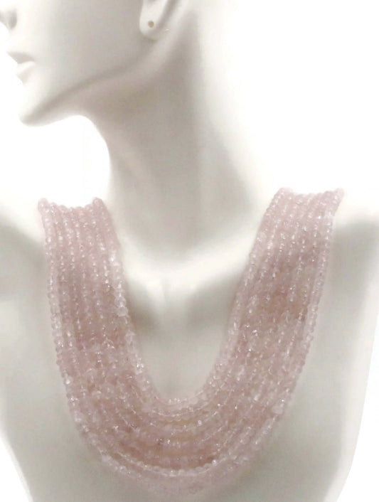 Natural Rose Quartz Bead Necklace displayed on a mannequin bust, showcasing its beautiful pink hues and layered design.
