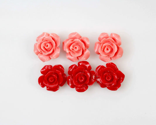 Coral rose flower beads 12mm in pink and red, showcasing beautiful floral designs for jewelry making.