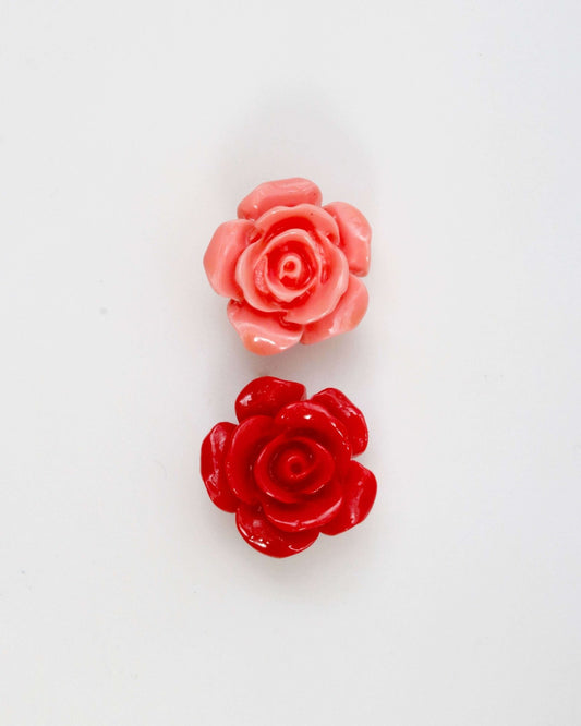 Coral rose flower beads 14mm in pink and red colors on a white background.