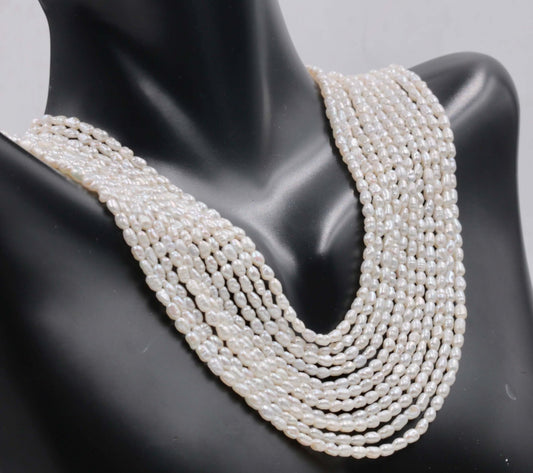Pearl Beads Strand featuring real freshwater pearls in a beautiful display on a mannequin.
