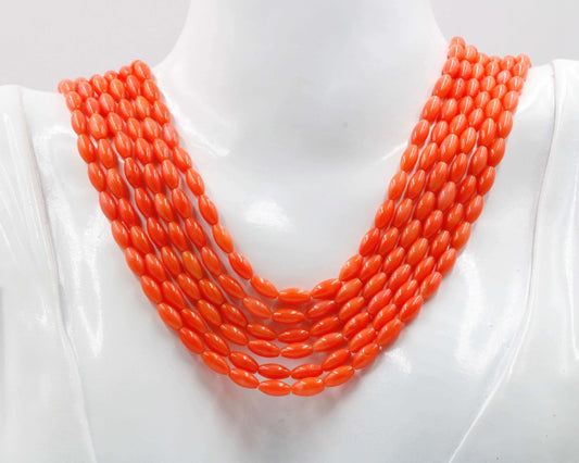 Natural Coral Beads Strands displayed in vibrant orange color on a mannequin neck.