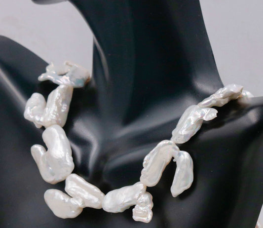 Elegant Pearl Beads necklace made with natural freshwater beads, displayed on a black bust.