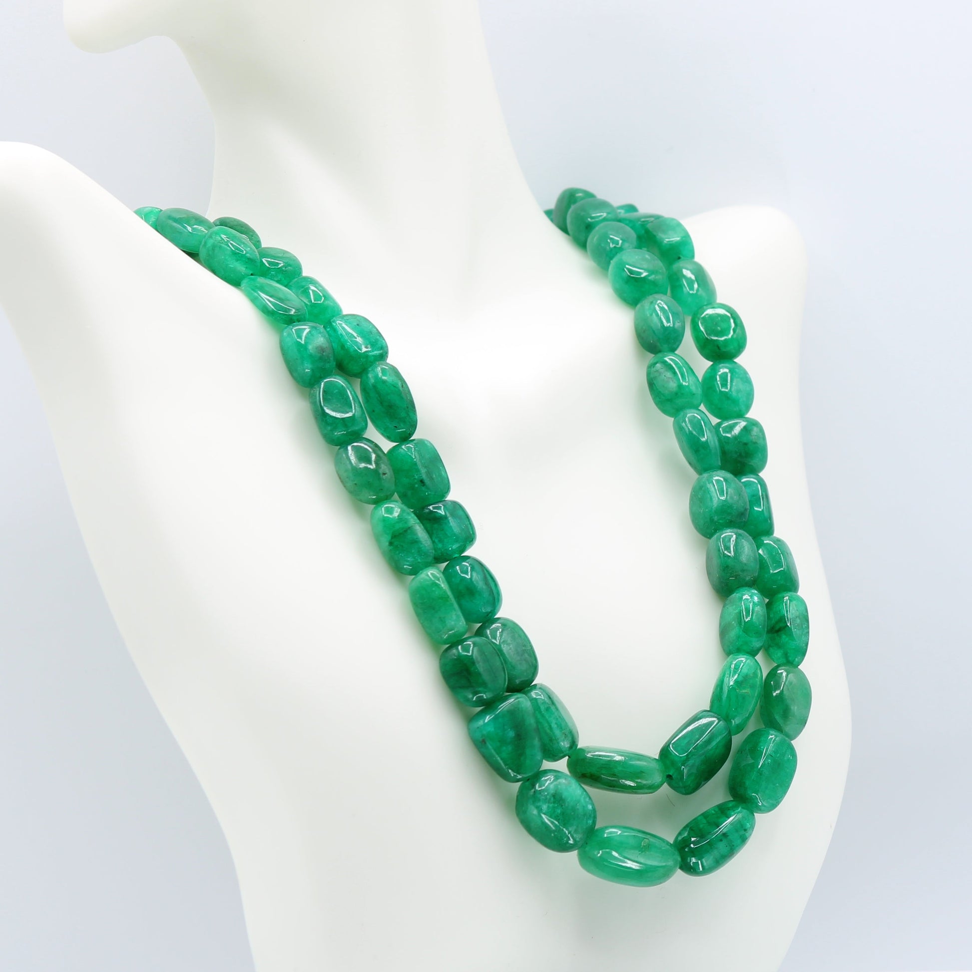 Natural Emerald Nugget Necklace showcasing vivid green emerald beryl gemstones in a semi-transparent shape.