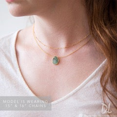 woman wearing gold chain pendant