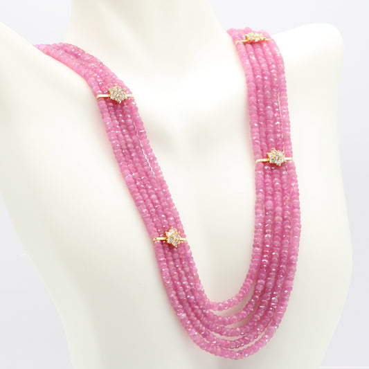 Natural Pink Sapphire Bead Necklace with gold accents featuring multiple strands of pink sapphires.