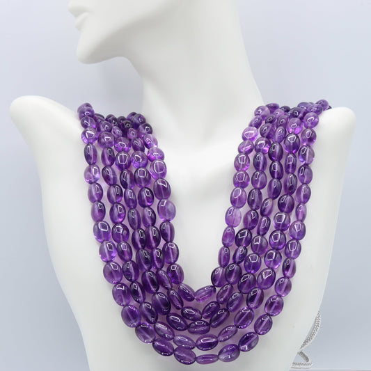 Amethyst Layered Necklace showcasing 5 strands of stunning violet amethyst beads on a display mannequin.