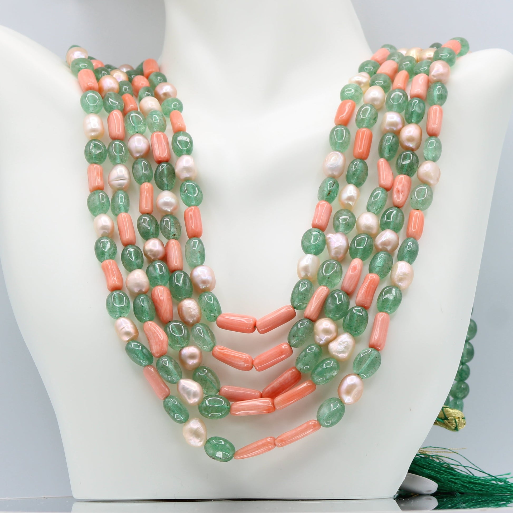 Russian Emerald with FWP and coral layered necklace showcasing vibrant beads and elegant design.