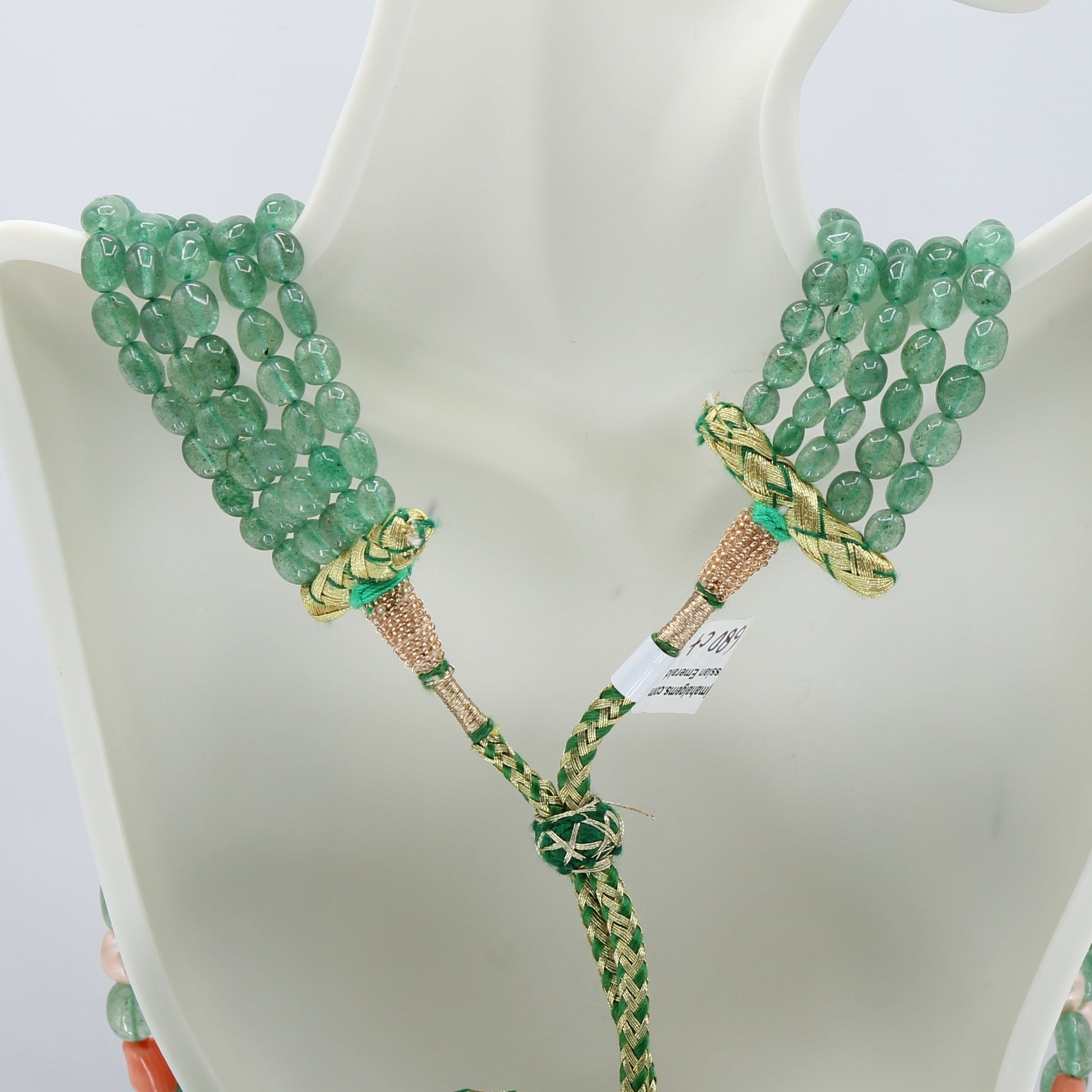 Russian Emerald with FWP & Coral Layered Necklace featuring layered green gemstones and braided cord design.