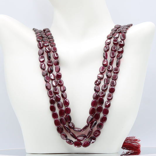 Rhodolite Garnet Smooth Polished Necklace displayed on a mannequin, showcasing its rose red to pale violet color.