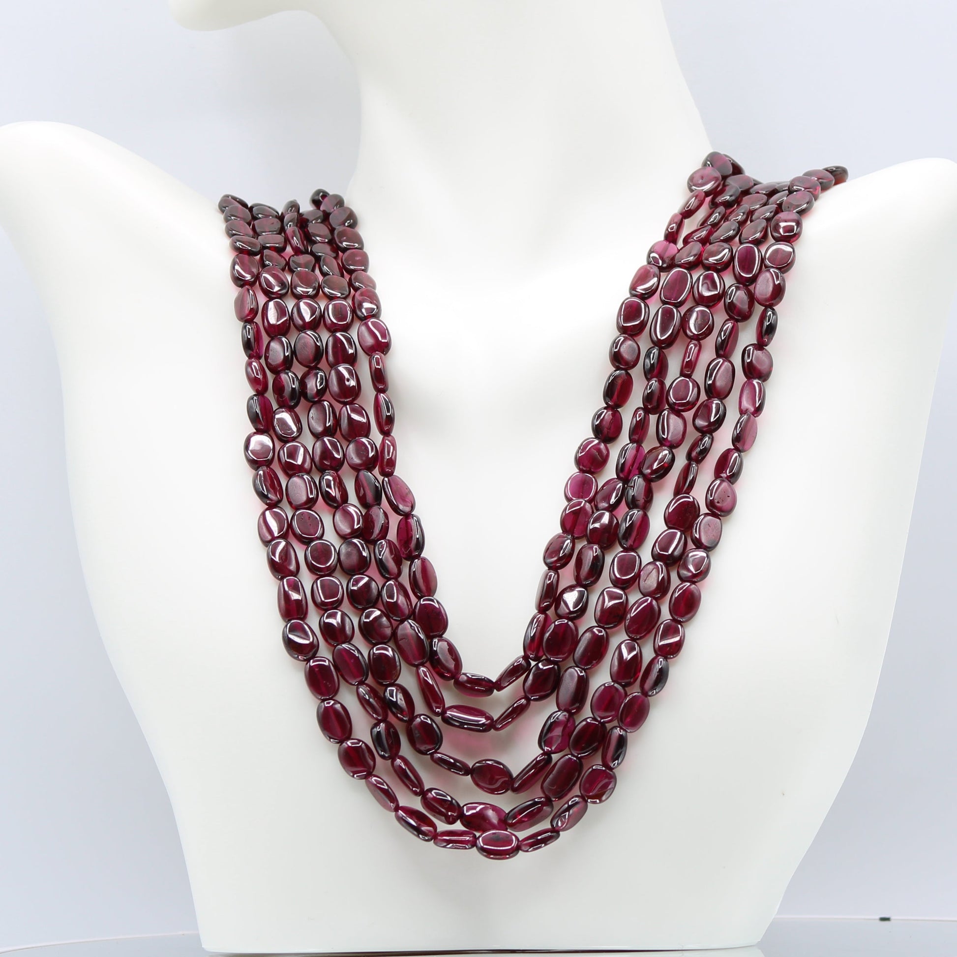 Rhodolite Garnet Smooth Polished Necklace displayed on a bust, showcasing rich rose red to pale violet hues.