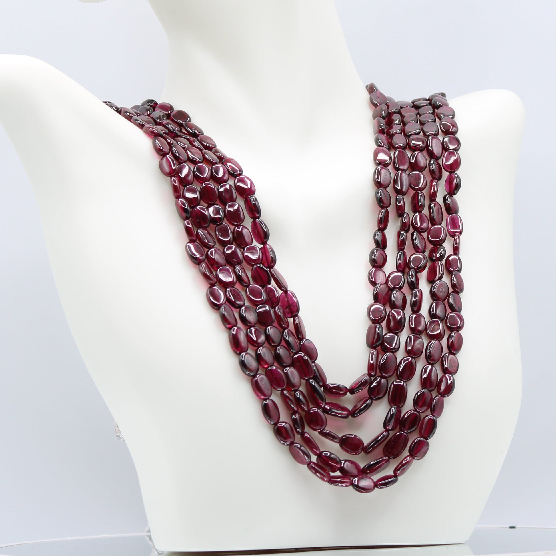 Rhodolite Garnet Smooth Polished Necklace displayed on a mannequin, showcasing its rich rose red color and elegant style.