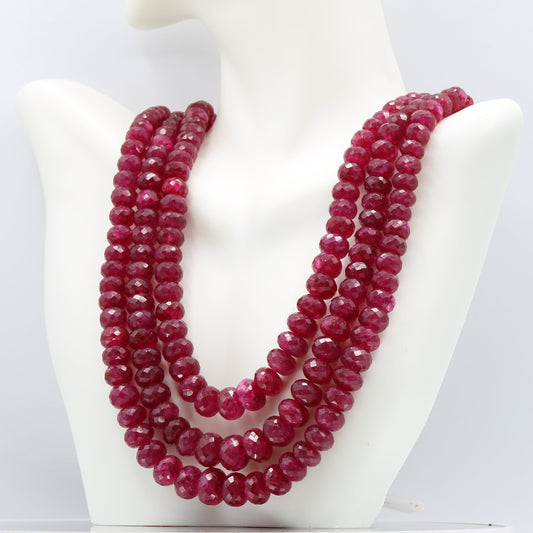 Ruby Necklace Faceted Beaded - Multi Strand featuring natural ruby beads in red, displayed elegantly on a mannequin.