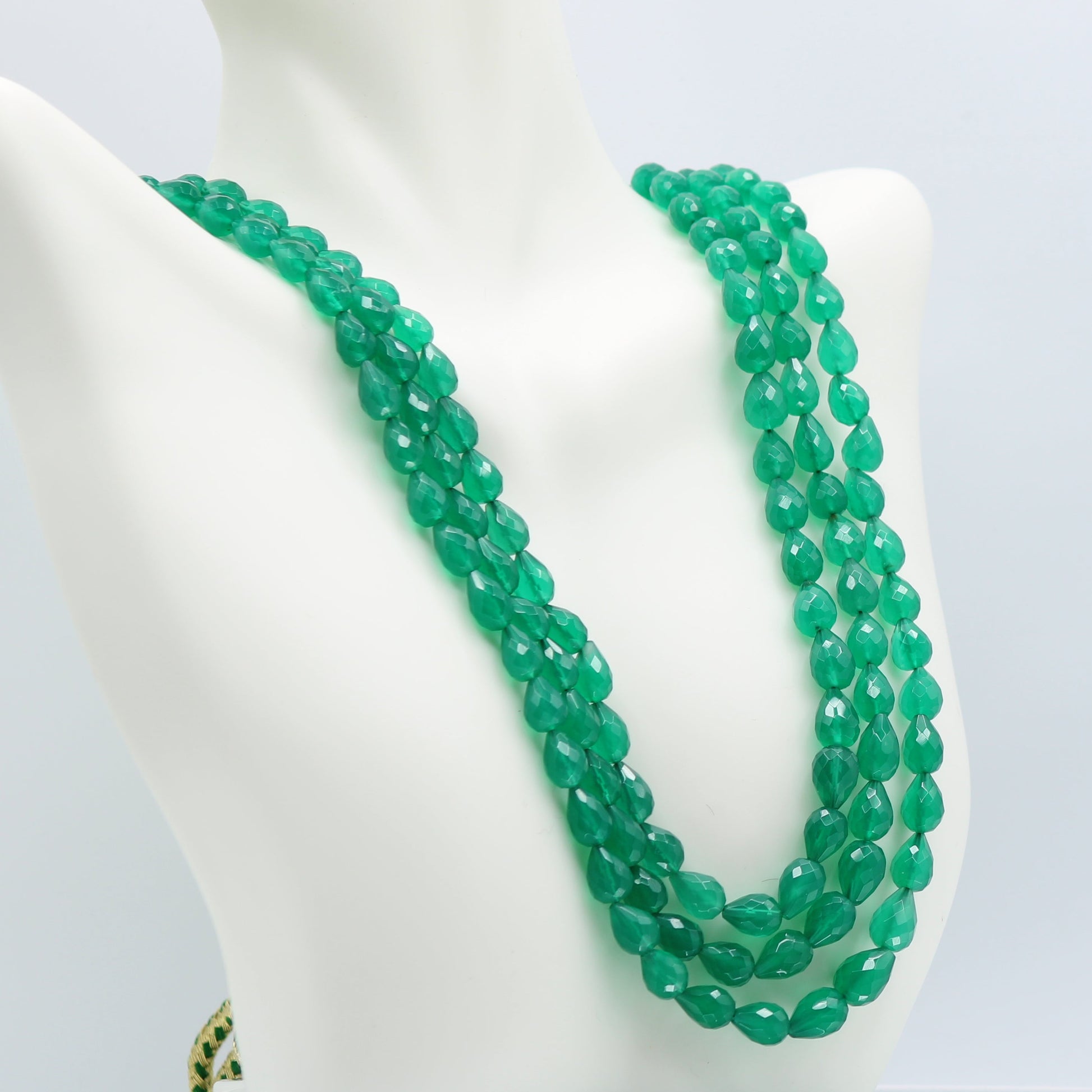 Emerald Pear Shape Faceted Necklace showcasing semi-transparent green gemstones in a 2, 3, and 5 strand design.