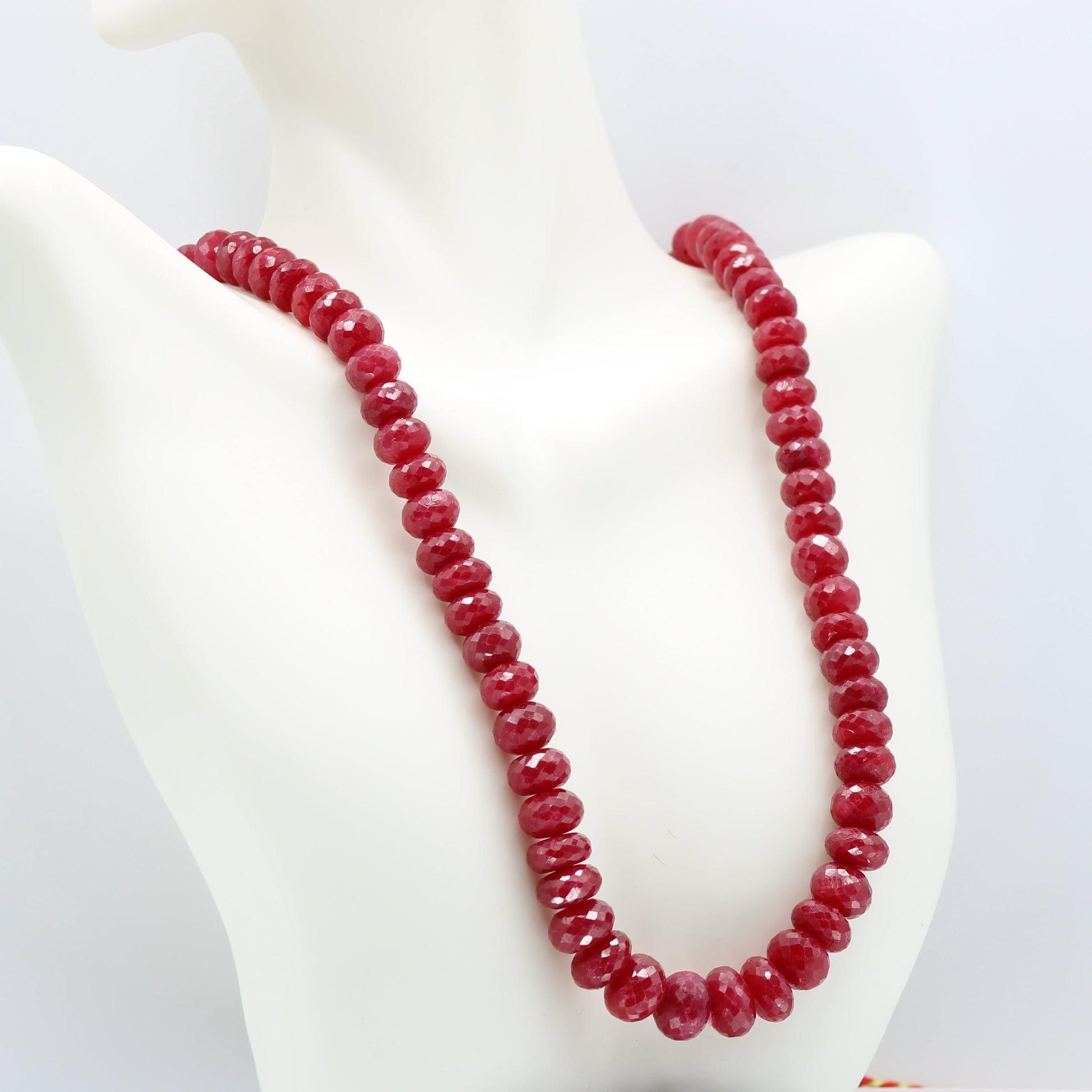 Ruby Necklace Faceted Beaded - Multi Strand showcasing semi-transparent natural rubies on a mannequin