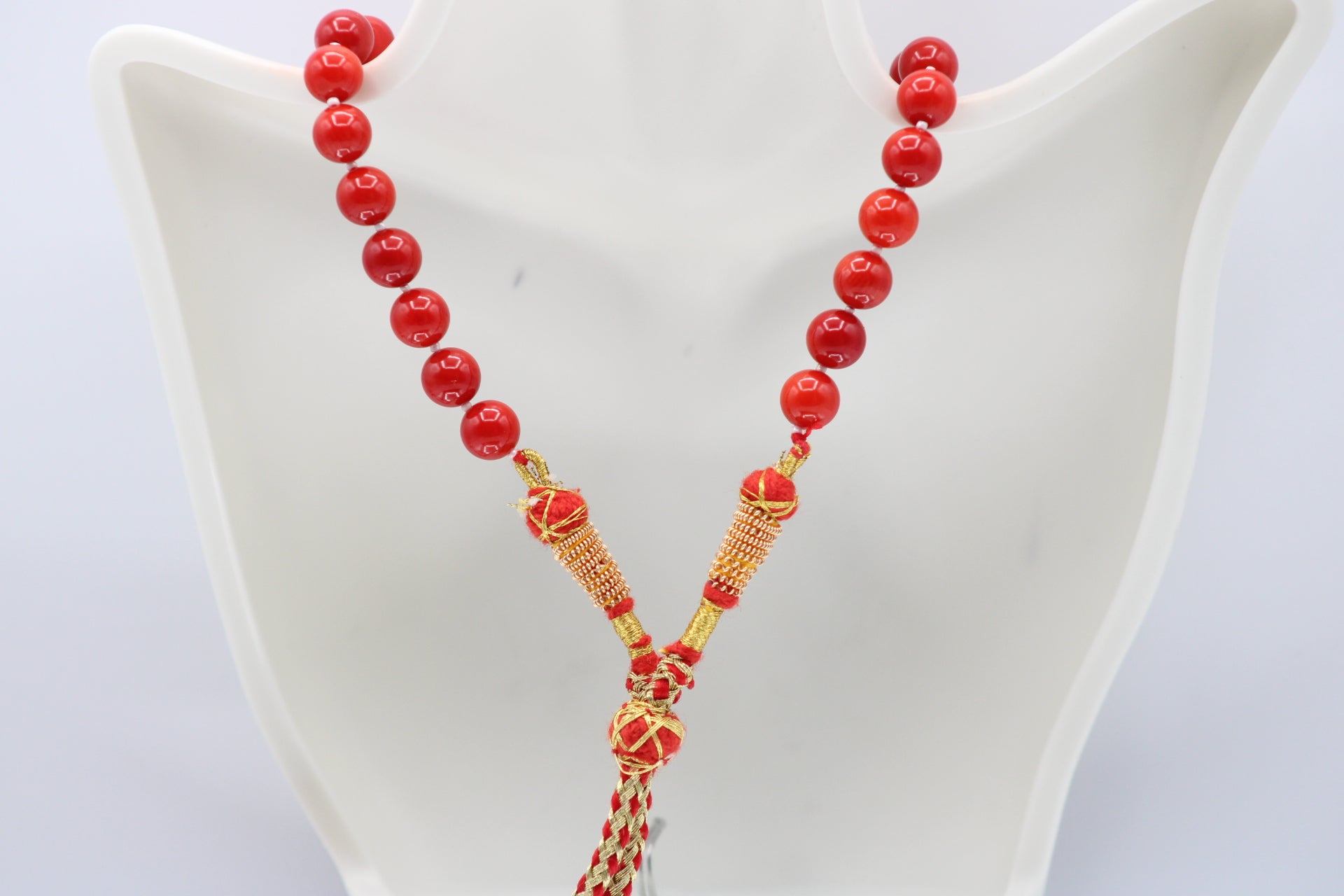 Natural orange coral gemstone necklace, 8-10mm strands on display, showcasing elegance and style.