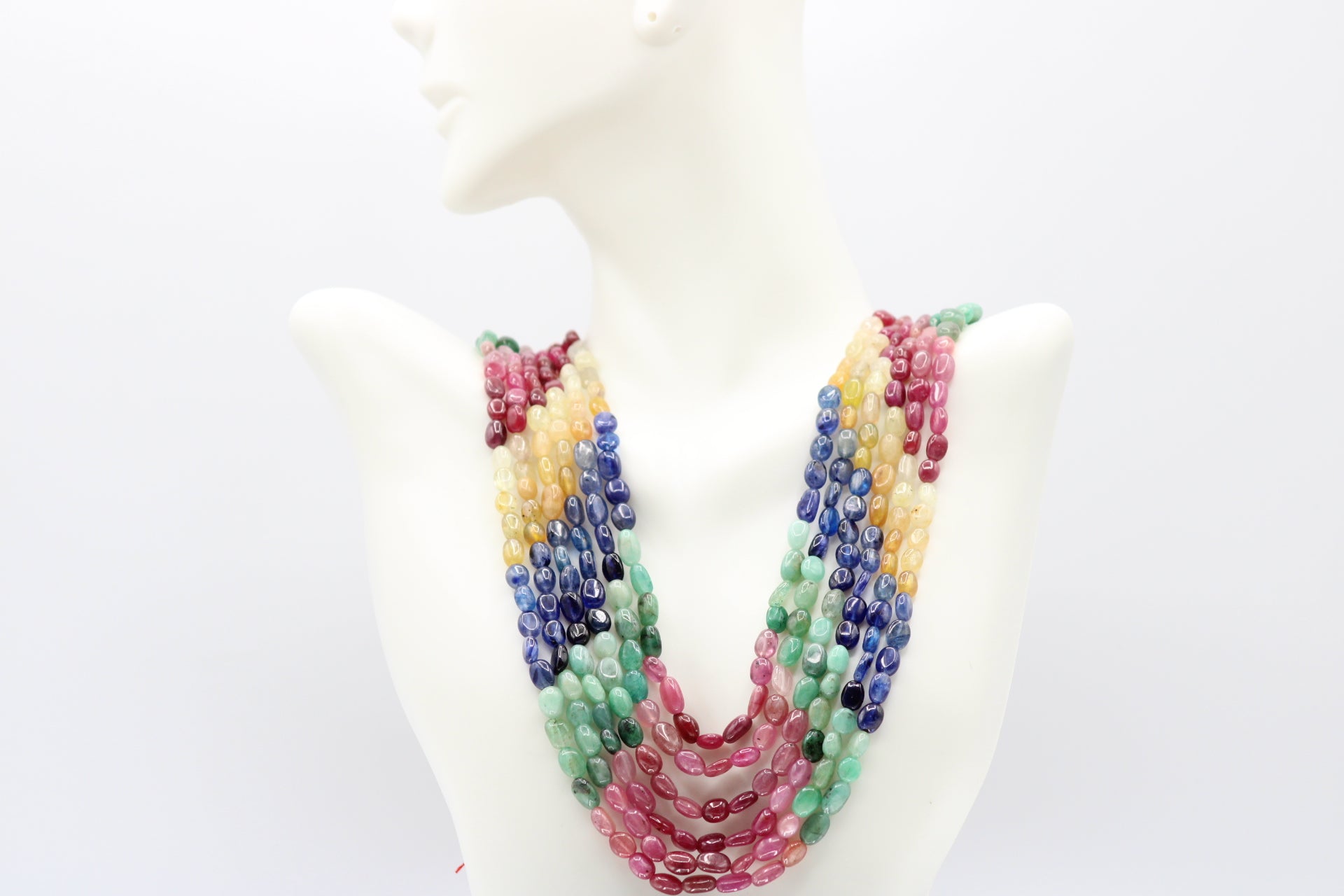 Multi Color Sapphire & Emerald Necklace featuring vibrant gemstones in various hues.