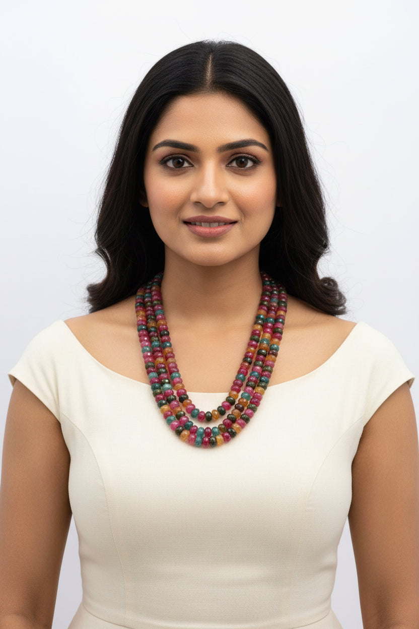 Multi-Color Jade Faceted Necklace worn by a woman, showcasing vibrant gemstones in yellow, blue, red, and green hues.