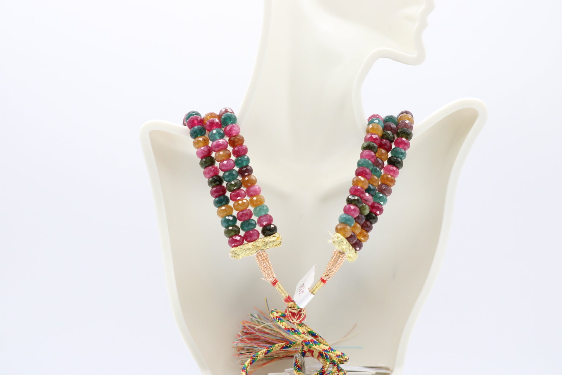 Multi-Color Jade Faceted Necklace featuring vibrant gemstones on a stylish display bust.