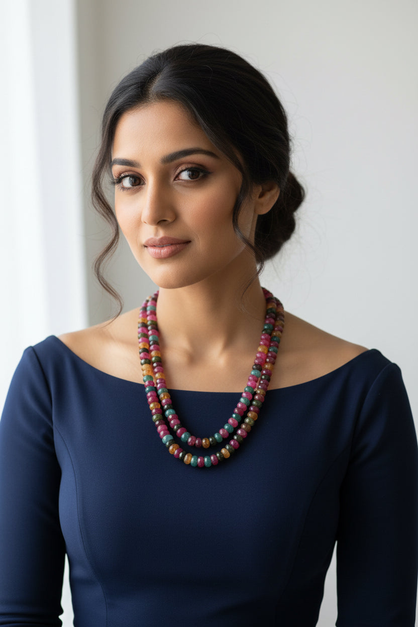 Model wearing a Multi-Color Jade Faceted Necklace, showcasing vibrant hues of jade gemstones.