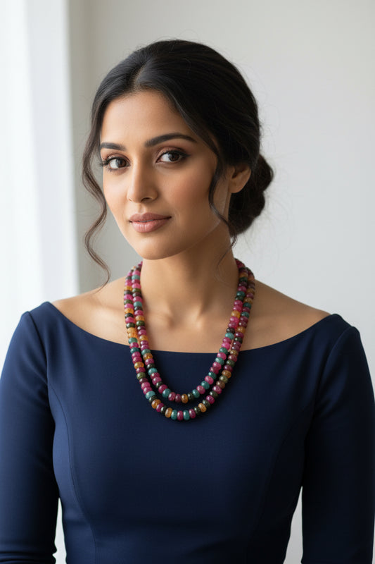 Model wearing a Multi-Color Jade Faceted Necklace, showcasing vibrant hues of jade gemstones.