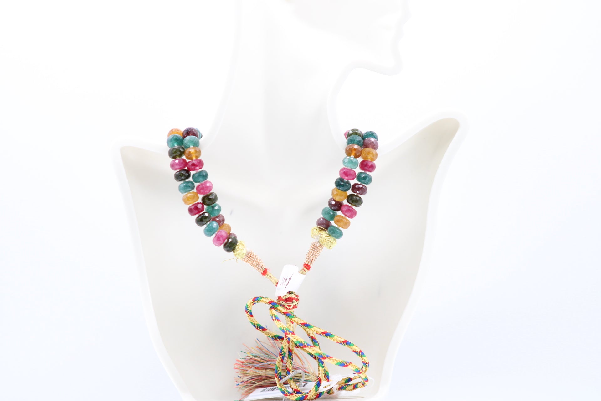 Multi Color Jade & Pearl Necklace showcasing vibrant gemstones and elegant pearls on a display bust.