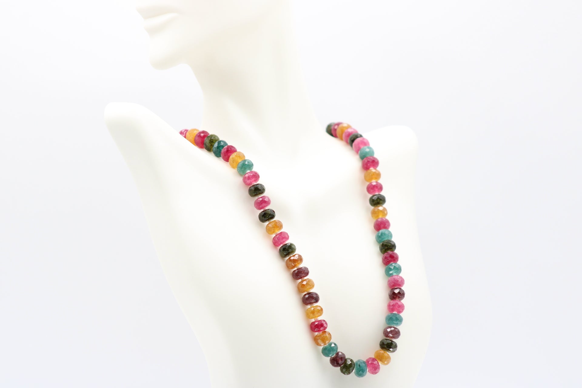 Multi Color Jade & Pearl Necklace showcasing vibrant jade gemstones and white pearls on a display bust.