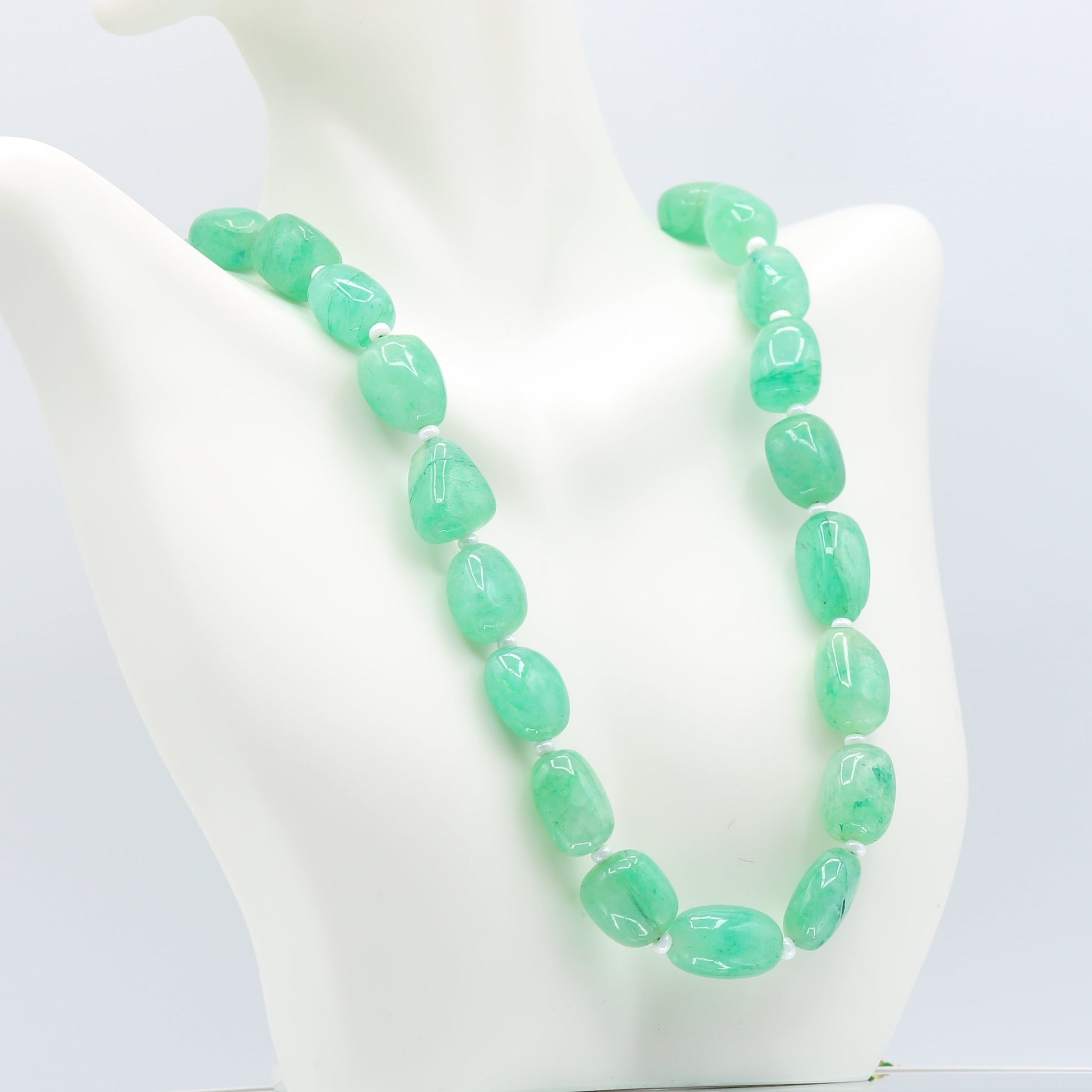 Emerald necklace featuring natural emerald beryl nuggets in bluish green hues.
