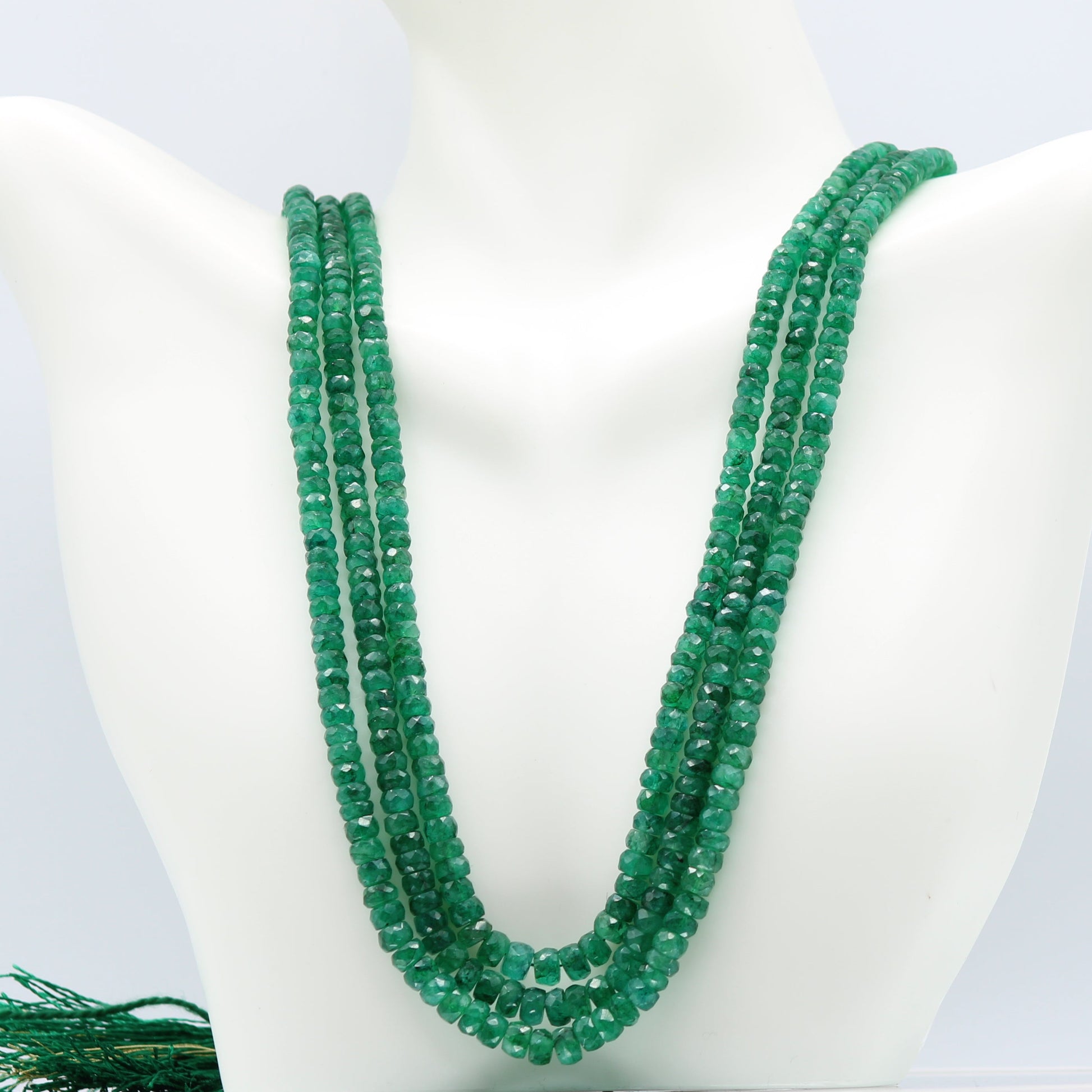 Emerald Multi Layered Necklace featuring faceted rondelle emerald gemstones in deep green color.