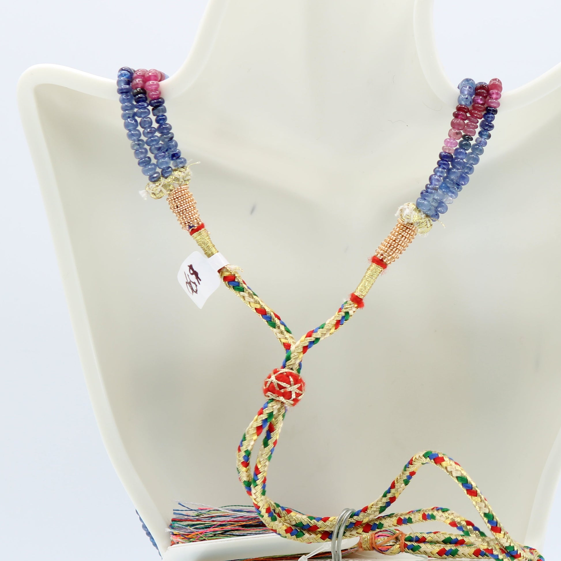 Multi Color Sapphire Beaded Necklace showcasing multi-color rondelle sapphires on a display bust.