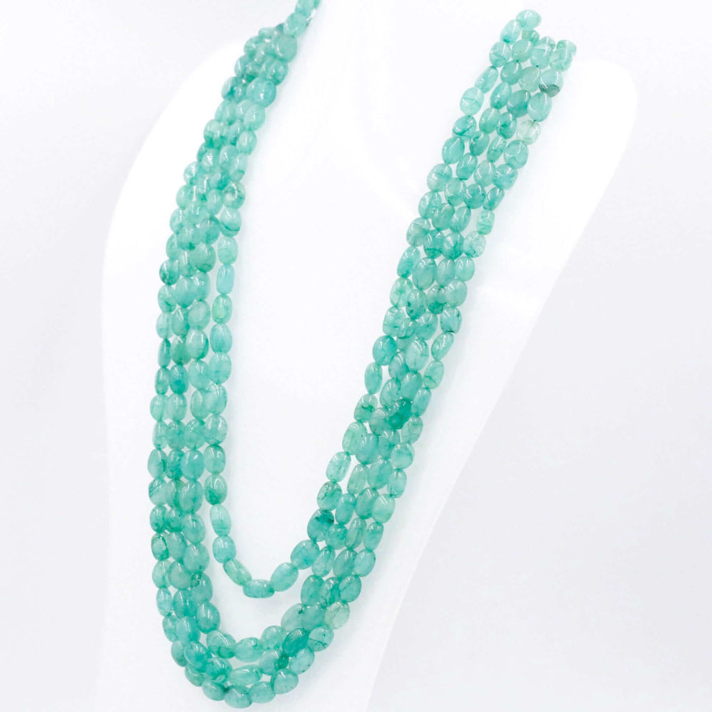 long necklace with multiple layers of green quartz gemstones