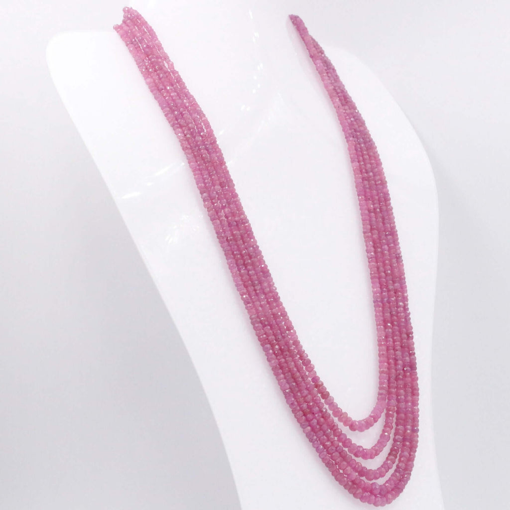 Gemstone necklace with multiple layers of pink sapphire beads