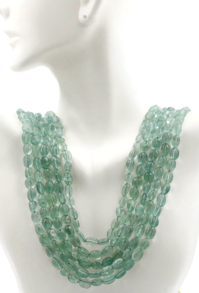 Indian sarafa necklace featuring vibrant green emerald beads