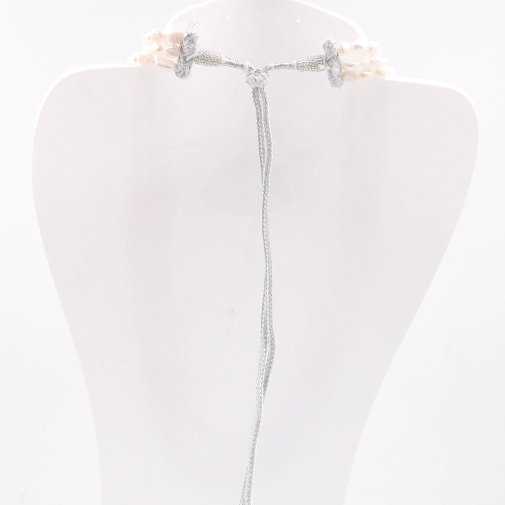 Indian necklace with multiple strands of shaded pearls